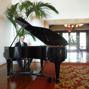 Kevin Fox at the piano before a wedding at The Montecito Club in Santa Barbara, California.