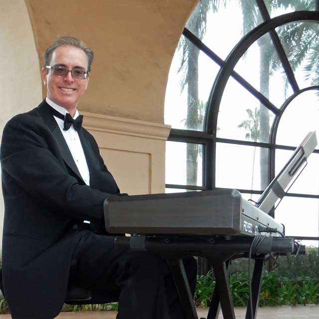 Pianist Kevin Fox, performing for a wedding ceremony on keyboard at the Hilton Santa Barbara Beachfront Resort.